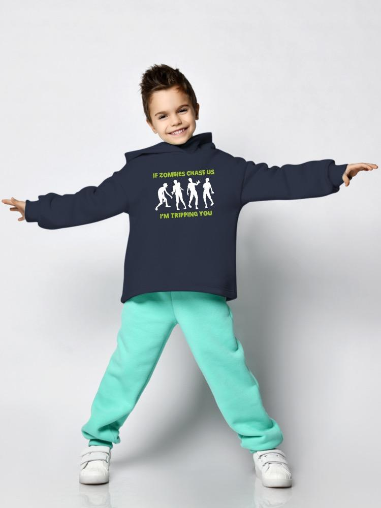 a boy wearing a blue sweatshirt with white text