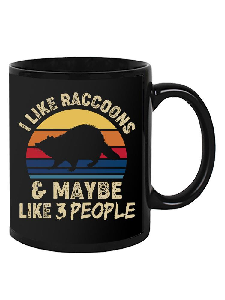 a black mug with a raccoon on it