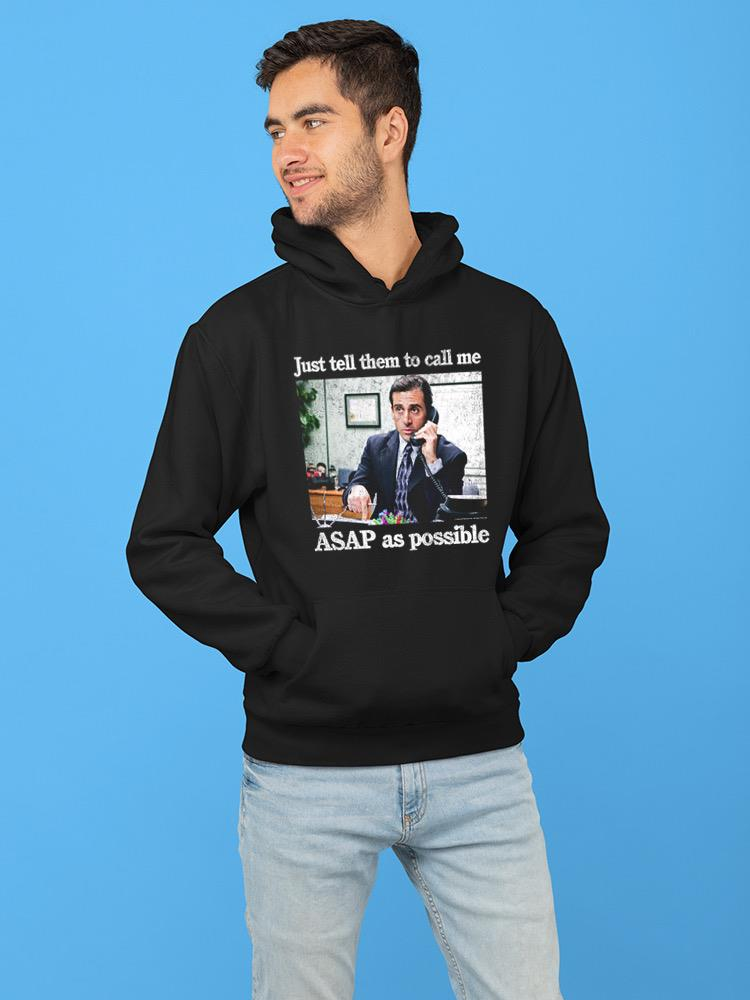 a man wearing a black hoodie