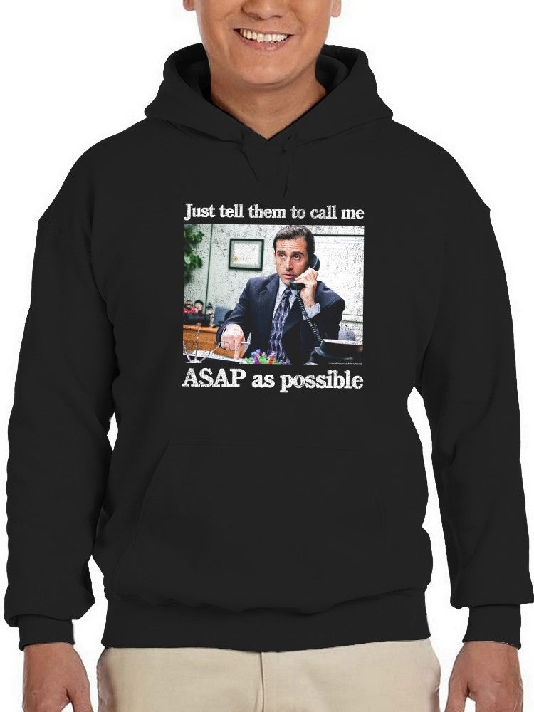a man wearing a black hoodie