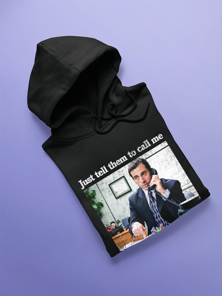 a black sweatshirt with a picture of a man on the phone