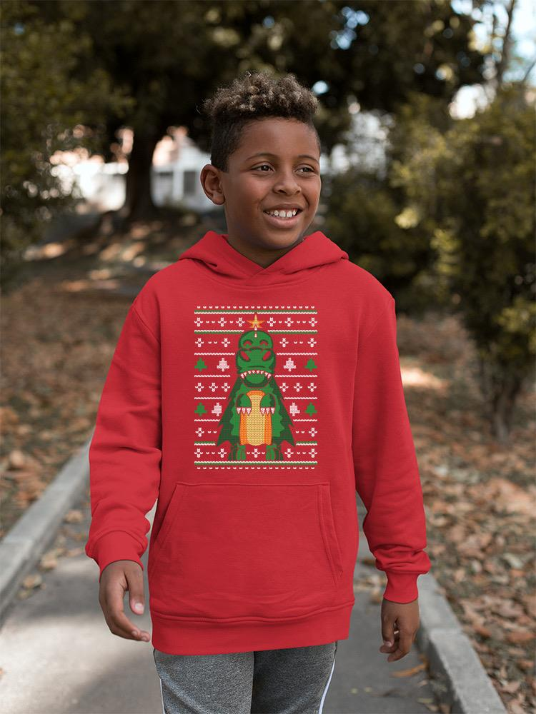a boy wearing a red sweater