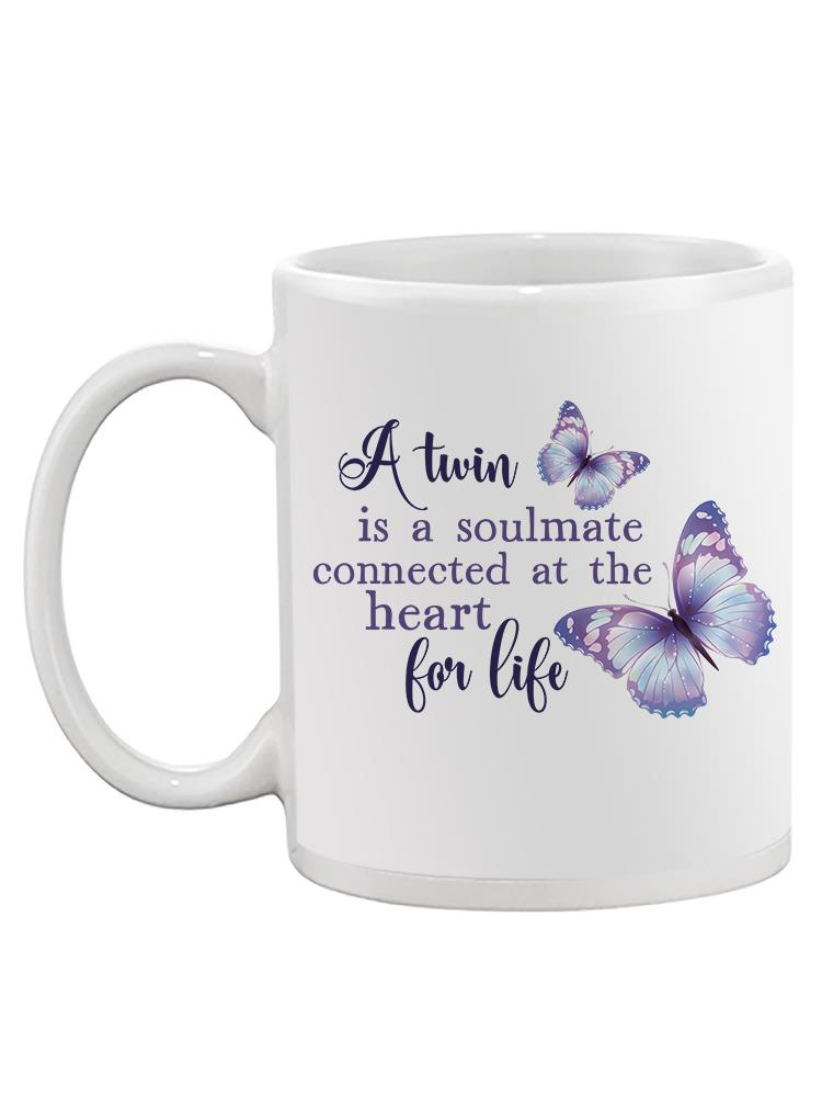 a white mug with purple butterflies