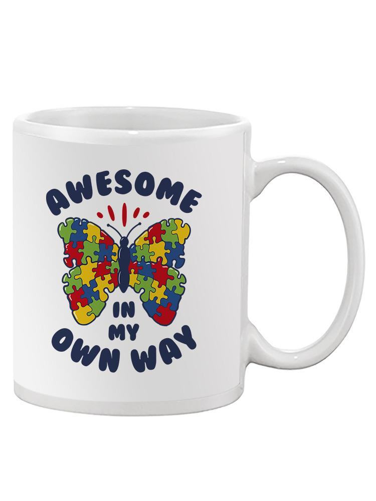 a white mug with a butterfly and puzzle pieces on it