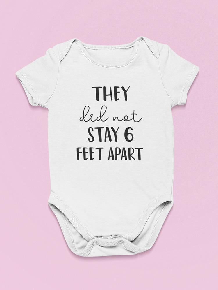 a white baby bodysuit with black text on it