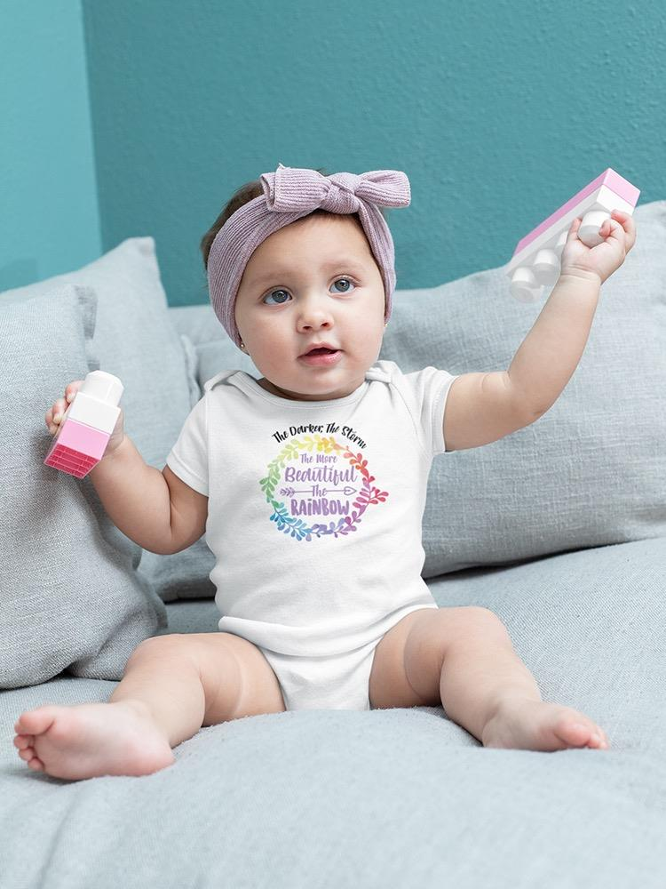 a baby holding a toy