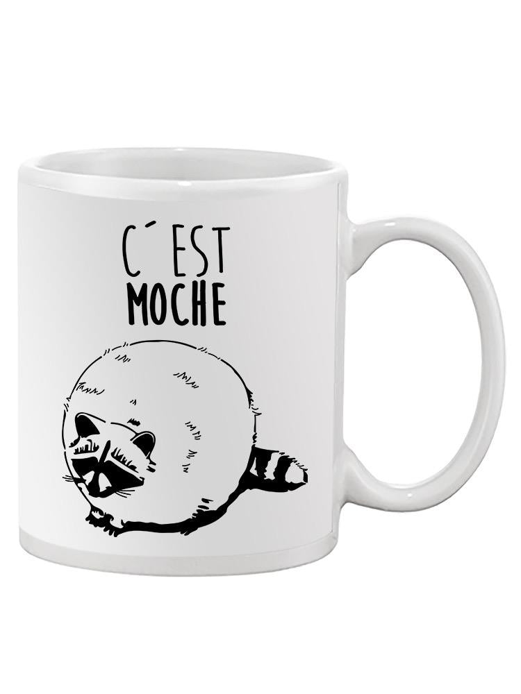 a white mug with a raccoon drawing on it