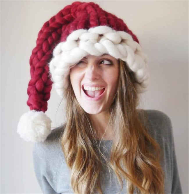a woman wearing a red and white knit hat