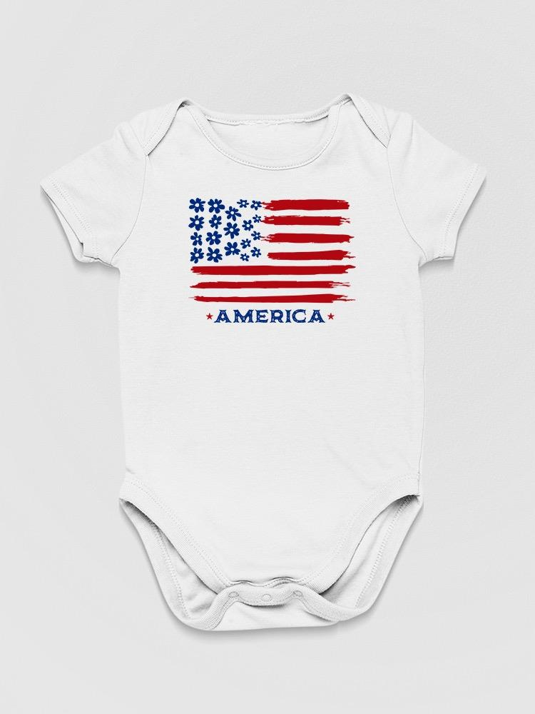 a white baby bodysuit with a flag on it
