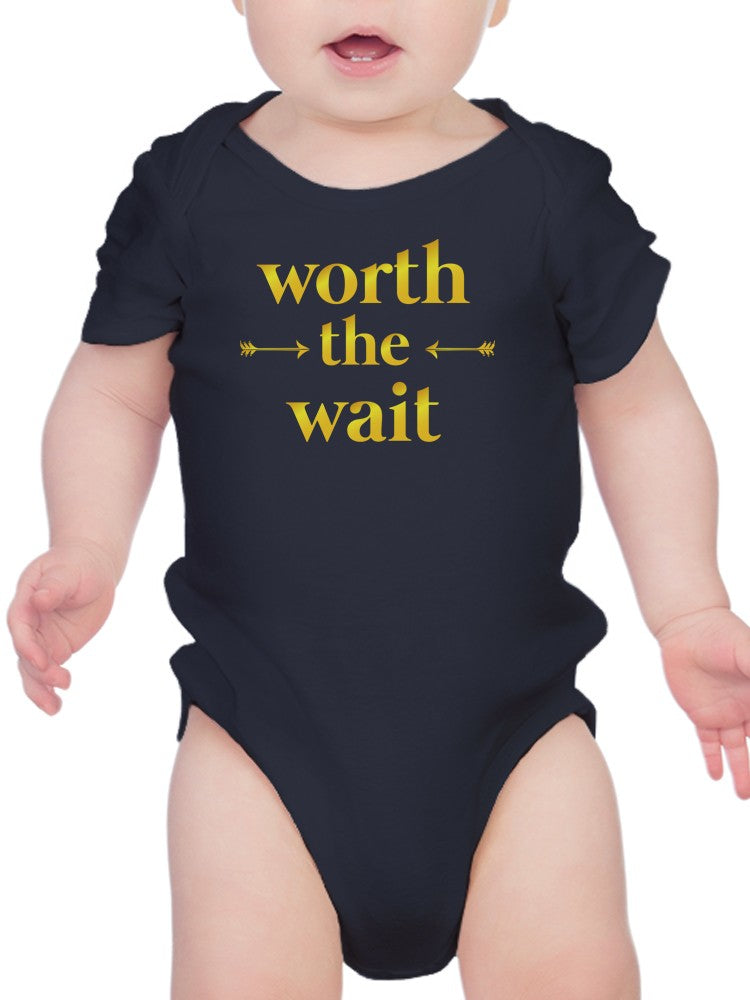 a baby wearing a black bodysuit