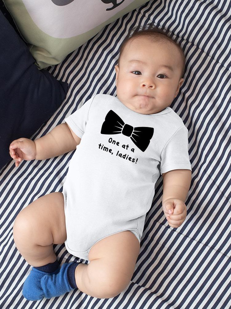 a baby lying on a bed
