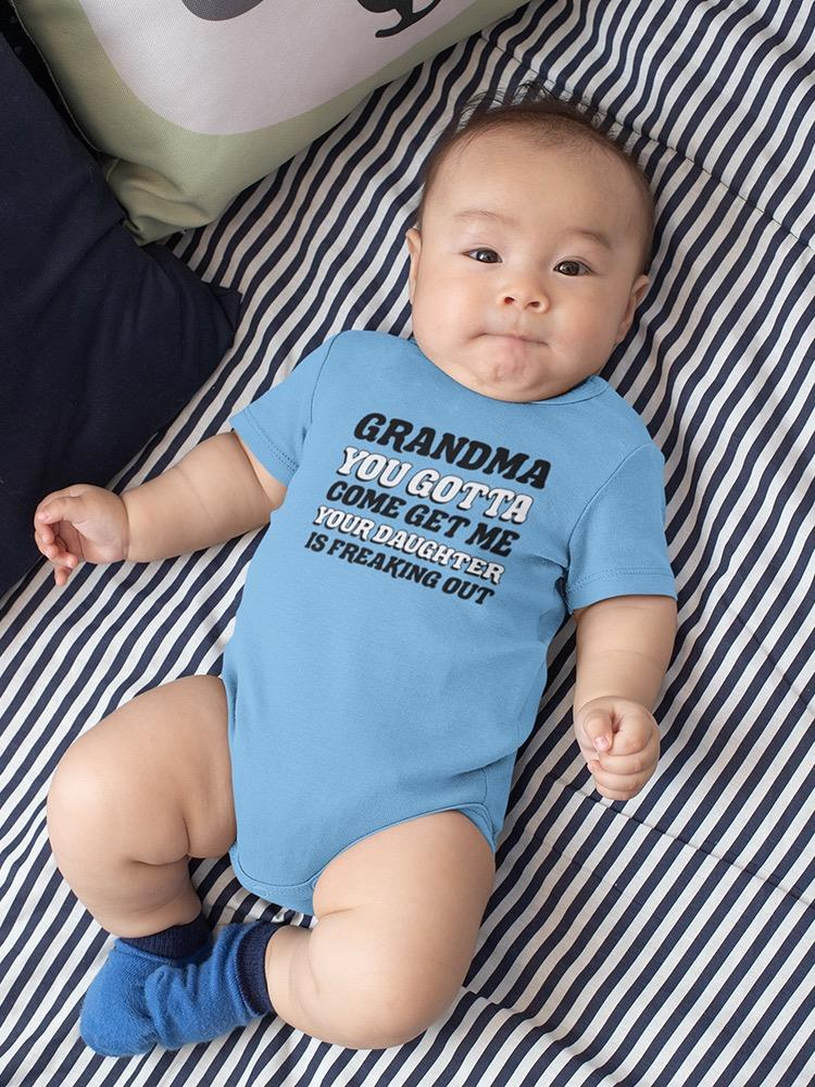 a baby lying on a bed