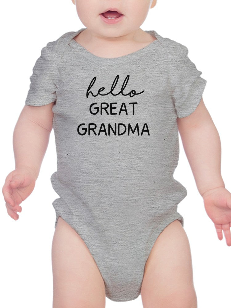 a baby wearing a grey bodysuit