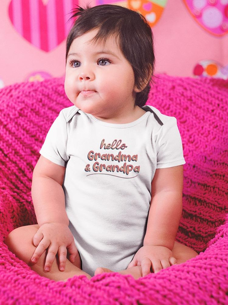 a baby sitting on a pink blanket