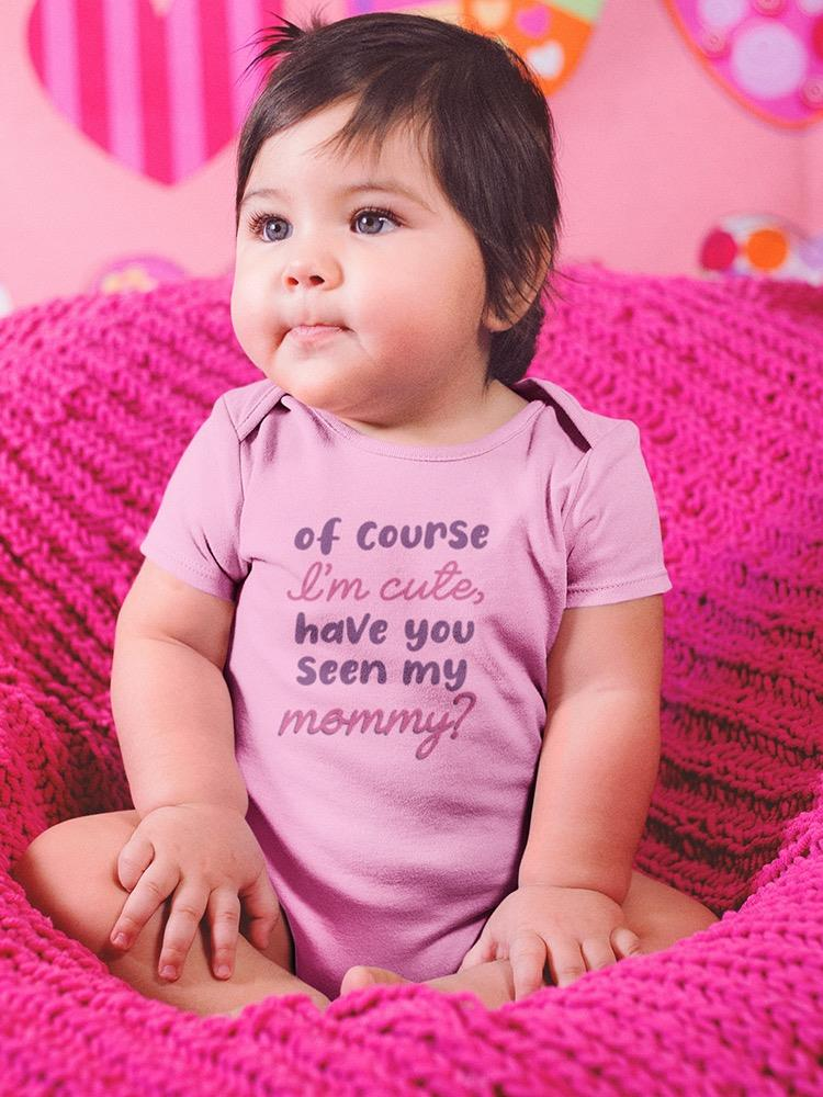 a baby sitting on a pink blanket