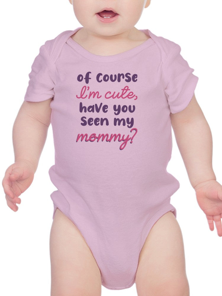 a baby wearing a pink shirt