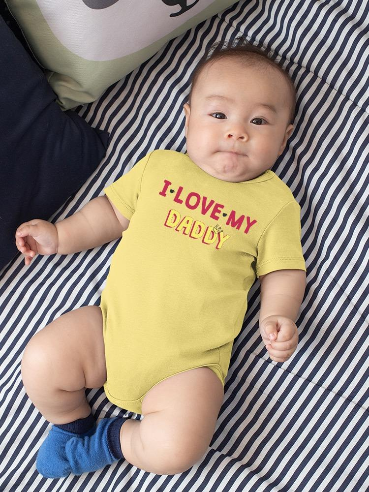 a baby lying on a striped surface