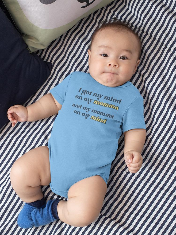 a baby lying on a bed