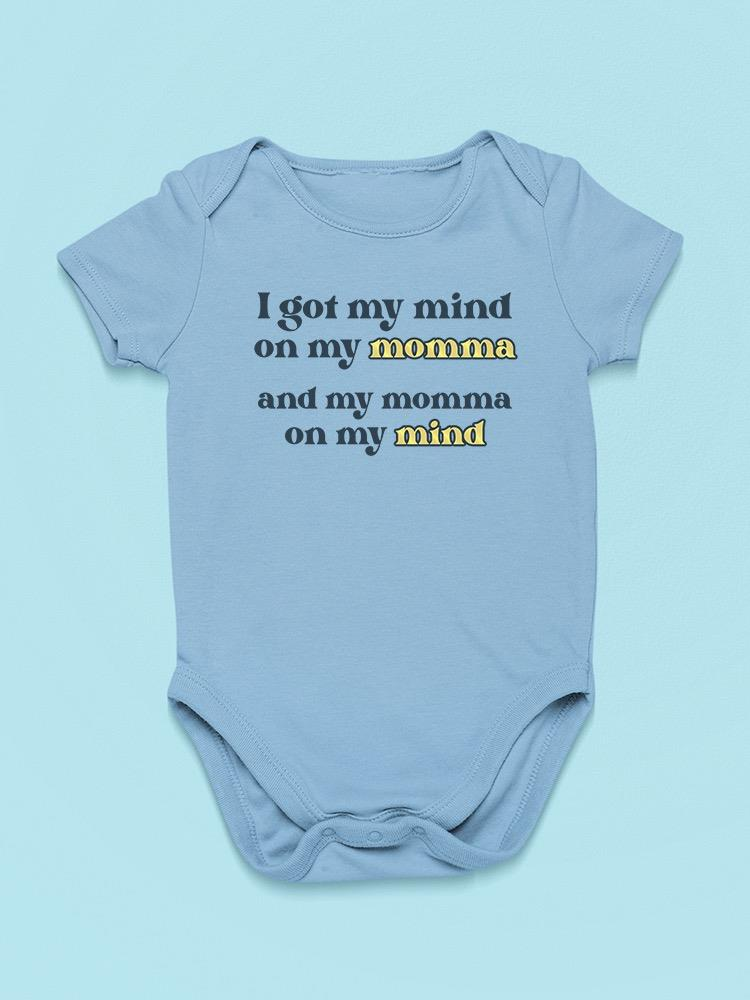 a blue baby bodysuit with black text