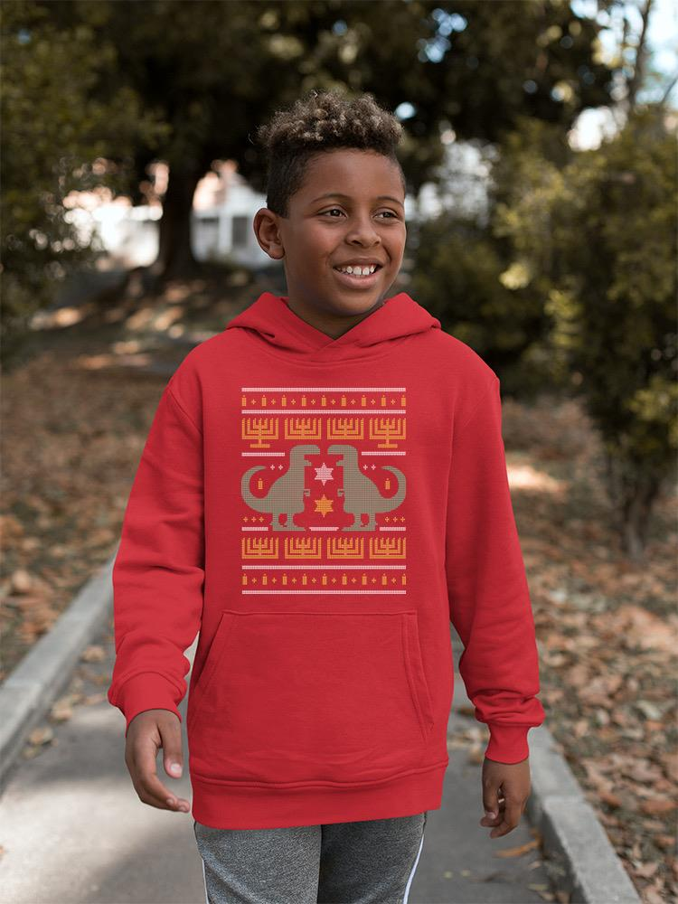 a boy wearing a red sweatshirt