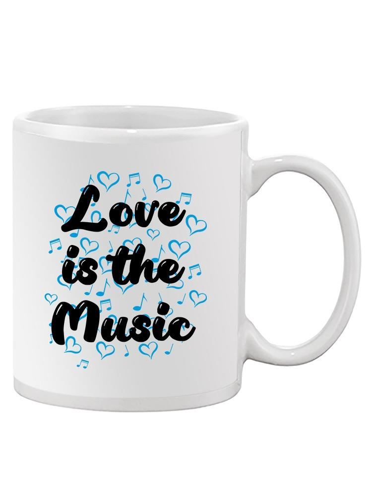 a white mug with blue hearts and notes