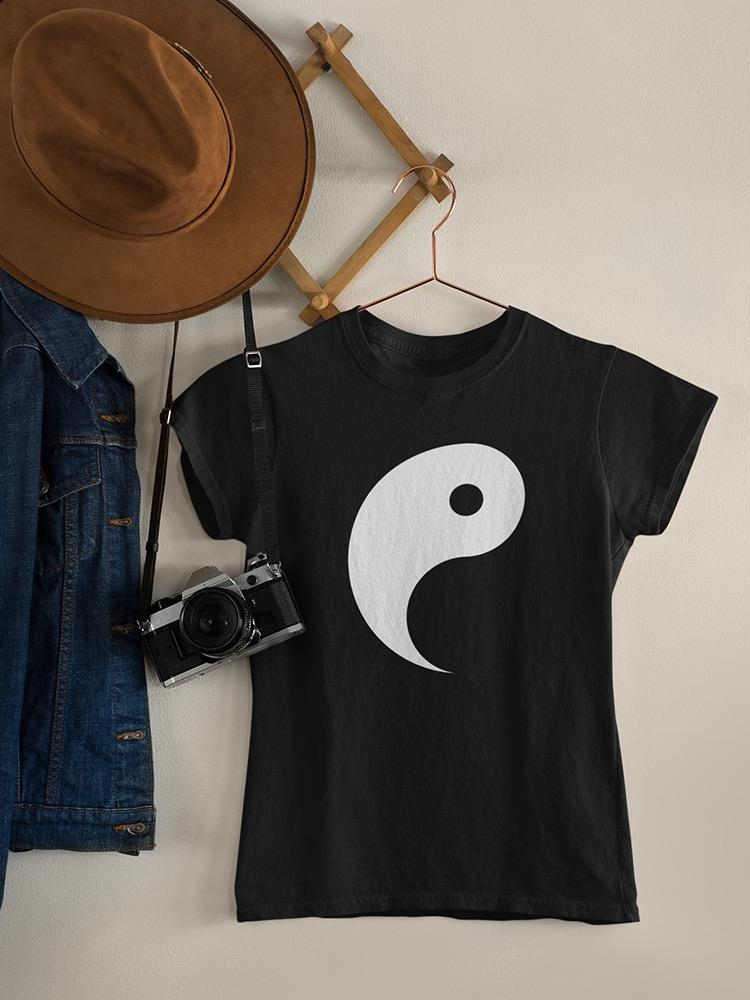 a black shirt with a white symbol on it and a hat and a camera on a wall