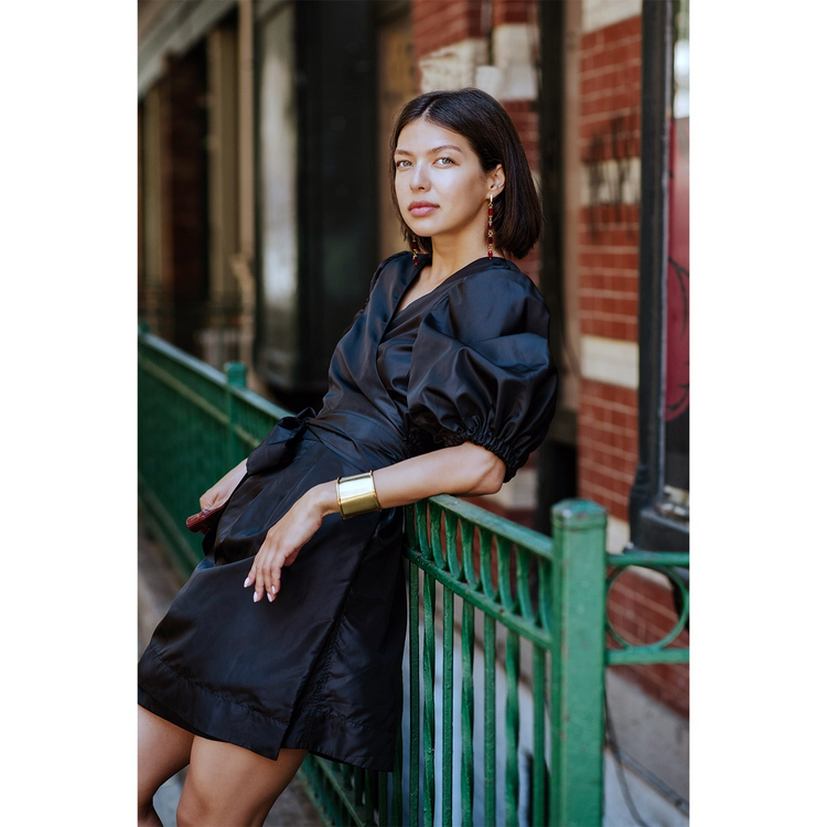 a woman leaning against a railing