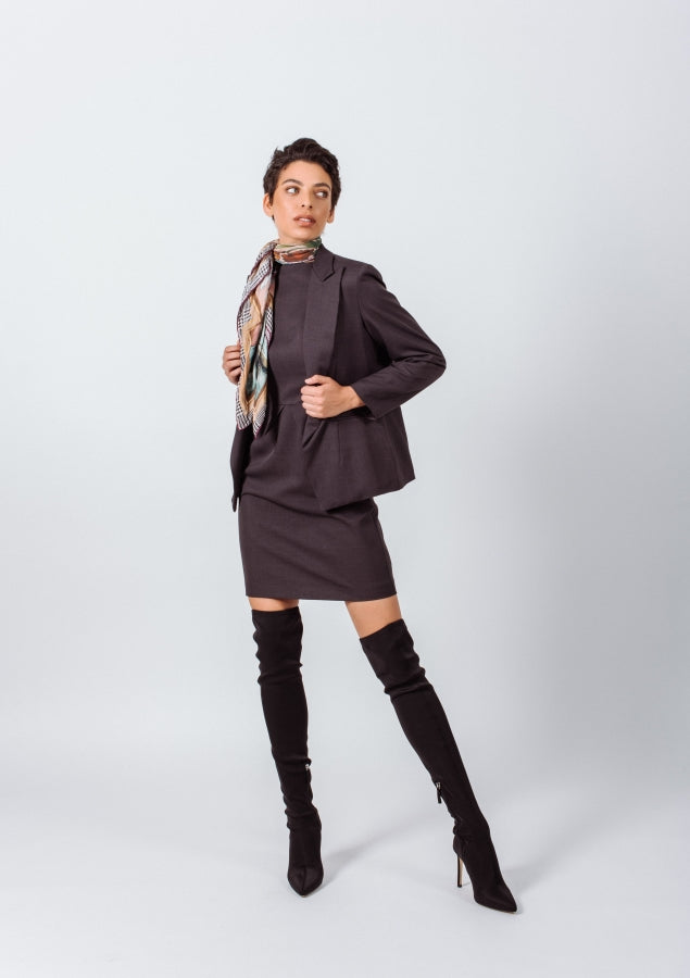 a woman in a dress and boots