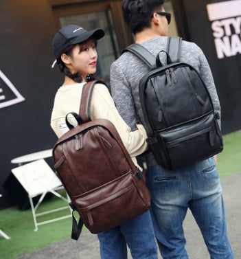 a man and woman with backpacks