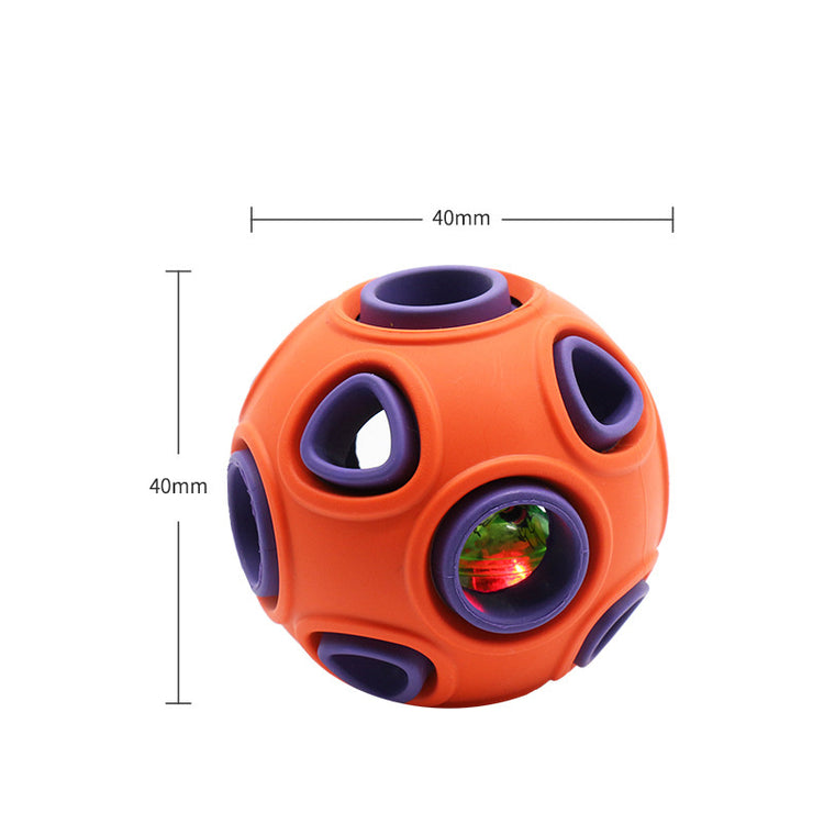 a small orange ball with purple and blue circles