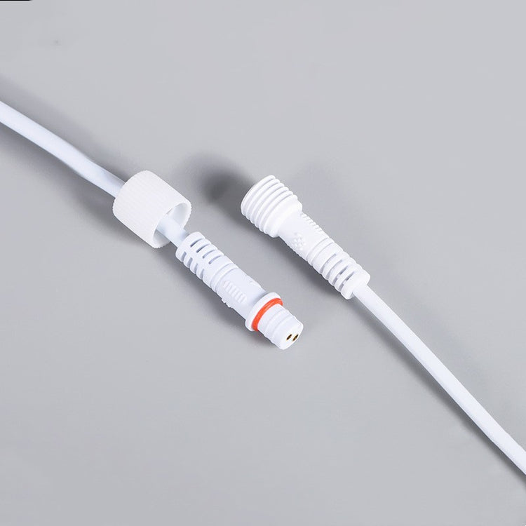 a white cable with a white cap