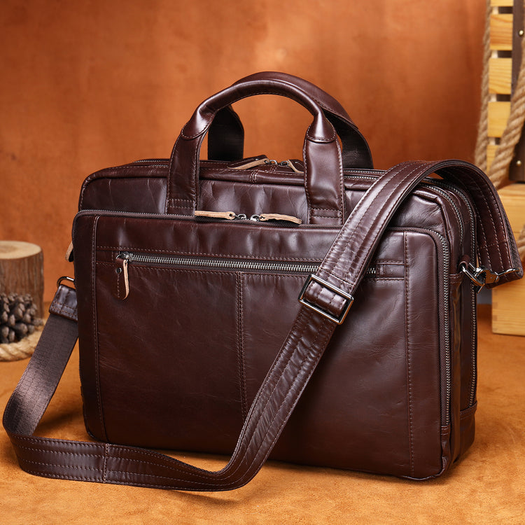 a brown leather briefcase on a brown surface