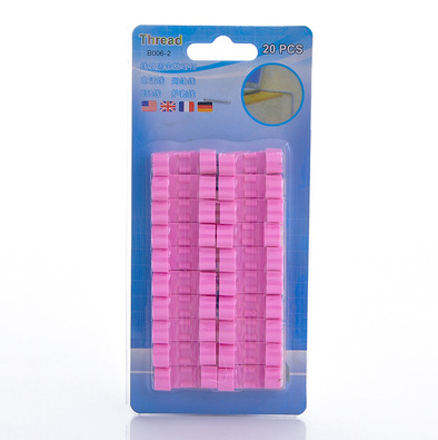 a pack of pink plastic clips