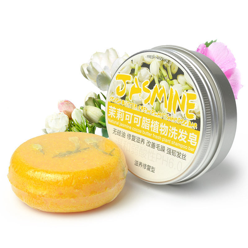 a jar of soap next to a round object