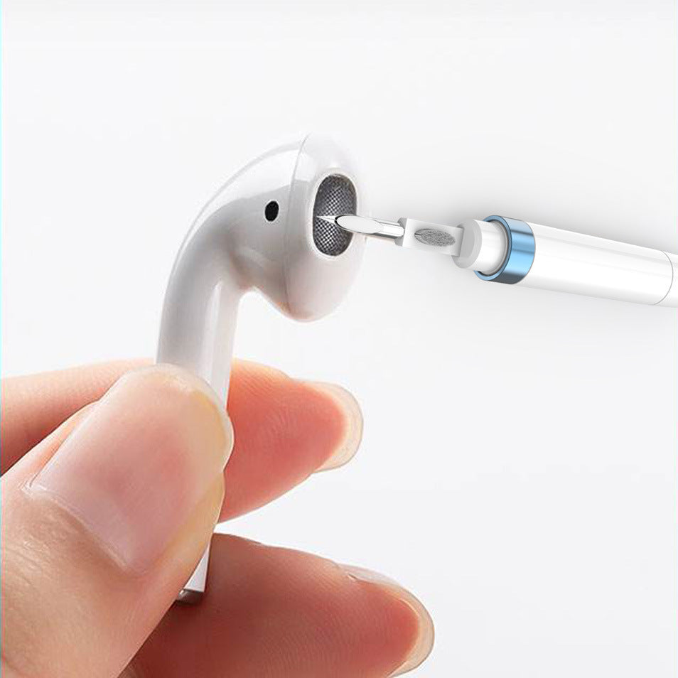a hand holding a white earbud
