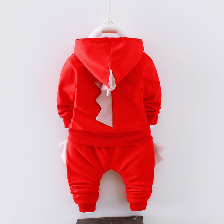 a red baby clothes on a swinger