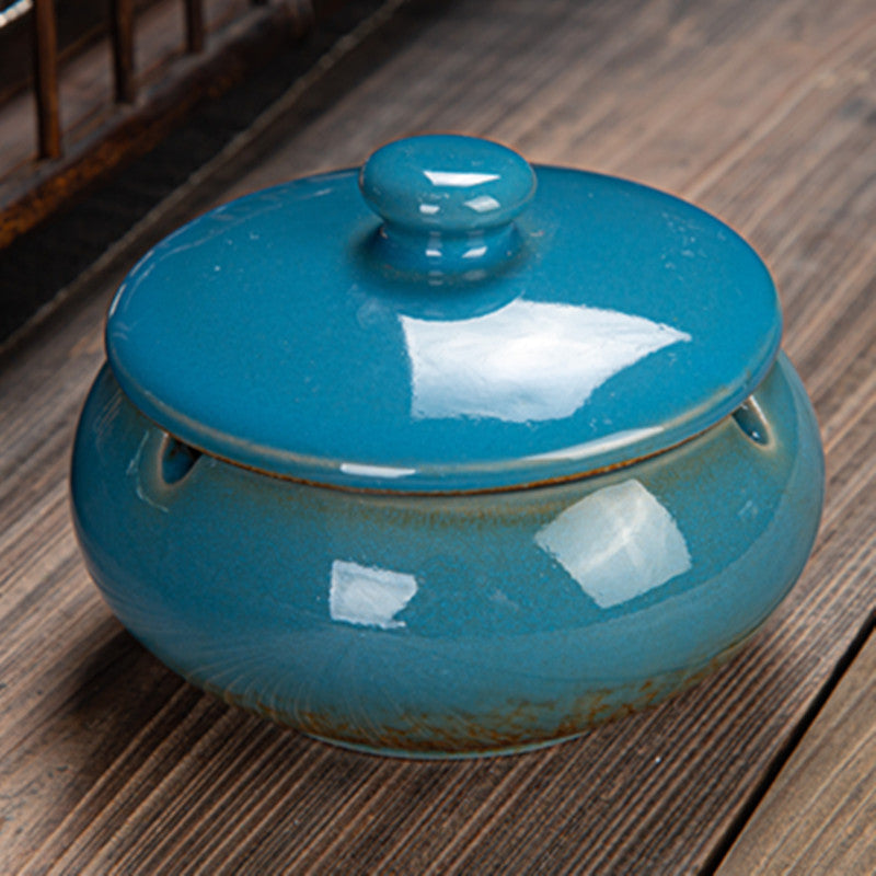 a blue ceramic container with a lid