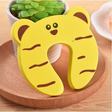 a yellow neck pillow on a wooden plate