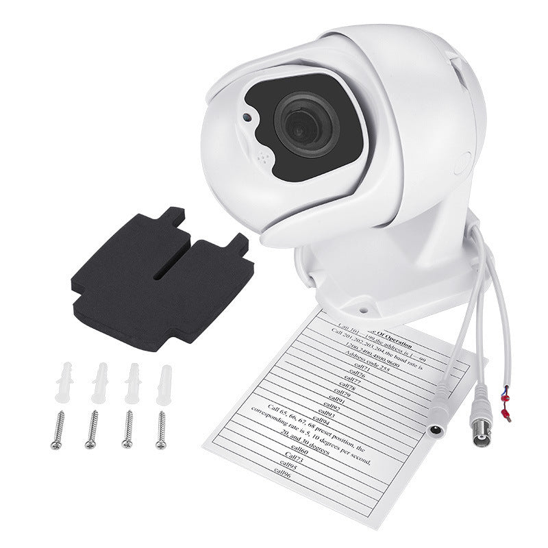 a white camera with a paper and cables
