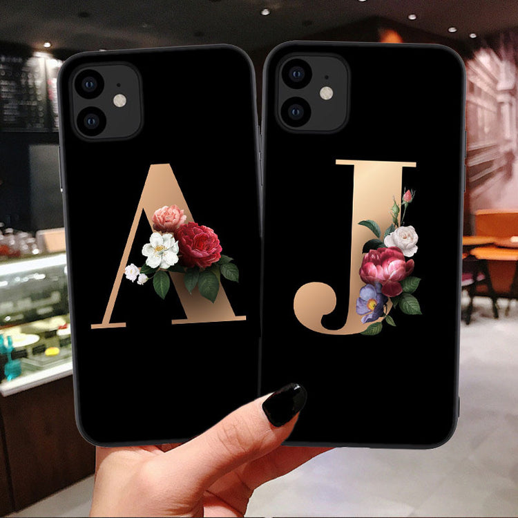 a hand holding a phone case with flowers on it