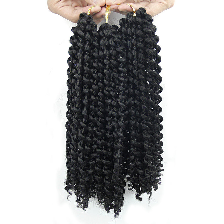 a hand holding a bunch of curly hair