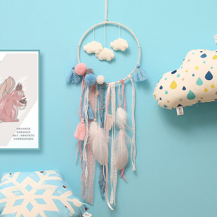 a dream catcher and a cloud pillow