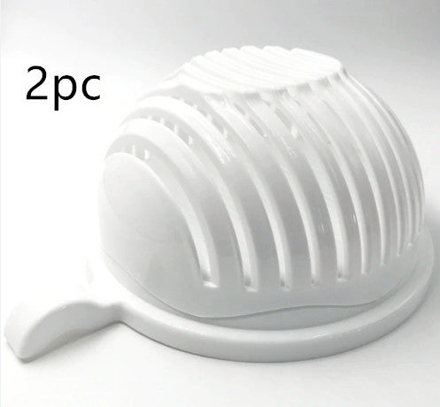 a white plastic fruit press