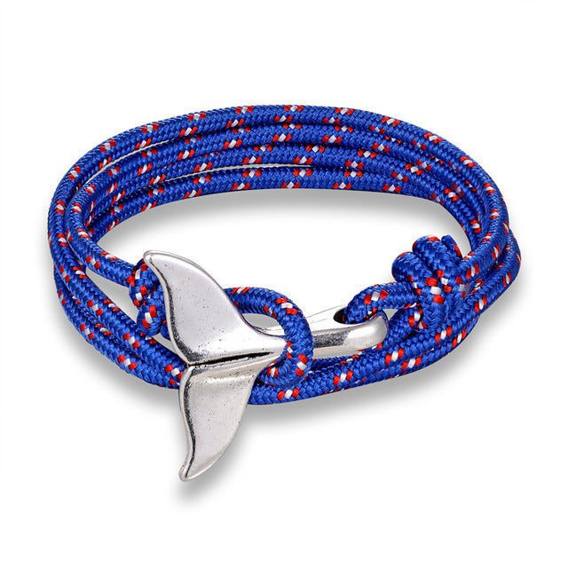 a blue and red rope bracelet with a silver whale tail