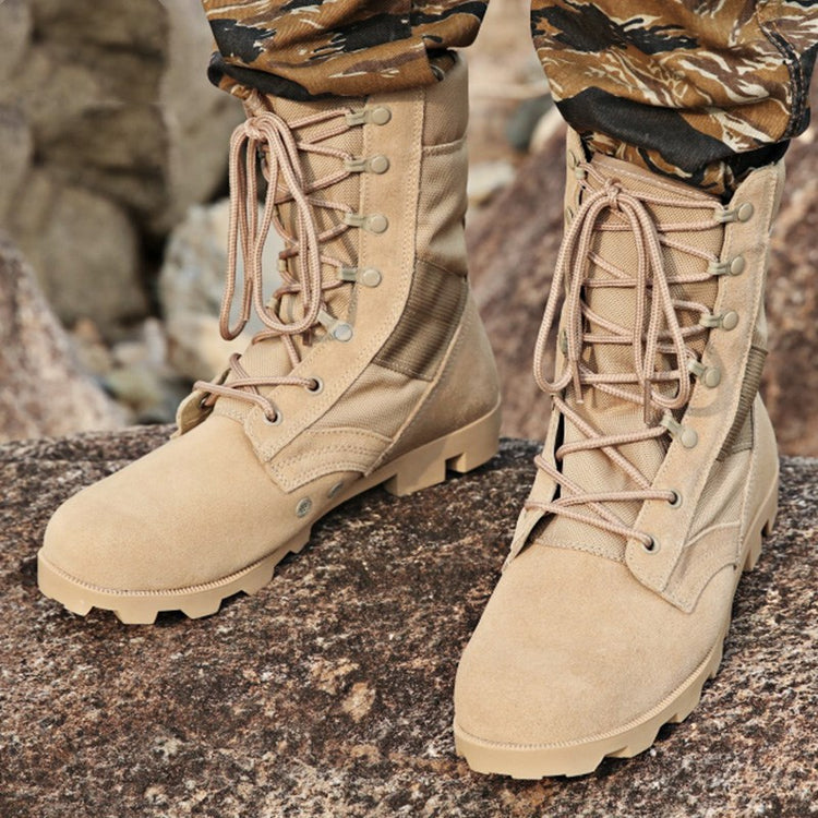 a person wearing tan boots and camouflage pants