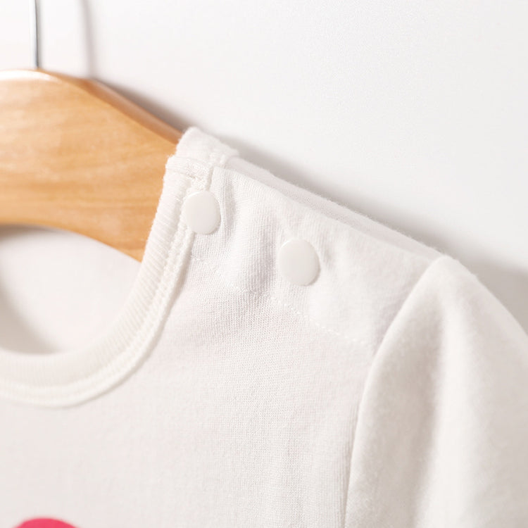 a white shirt on a swinger
