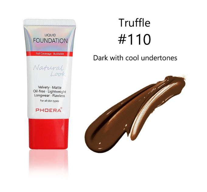a tube of foundation with a red cap