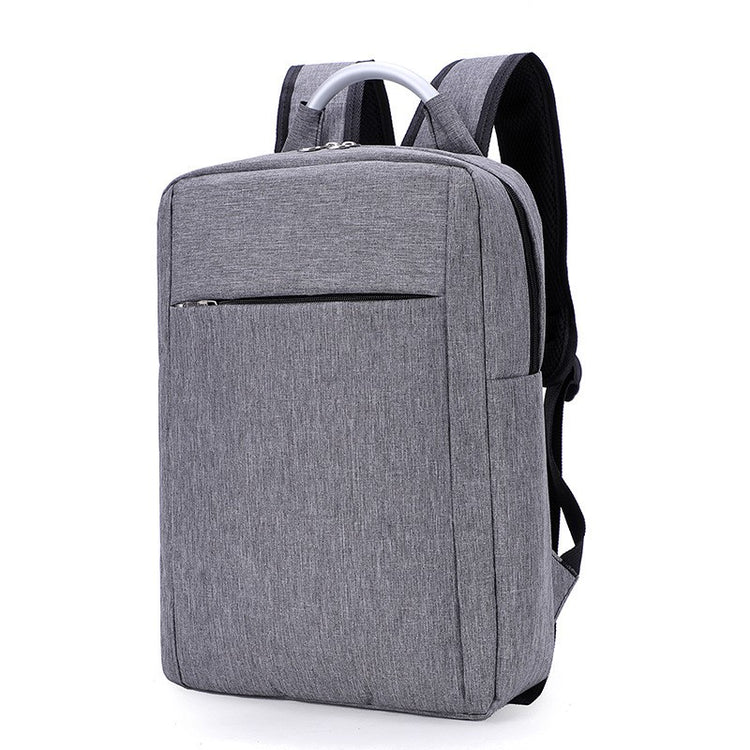 a grey backpack with a white handle