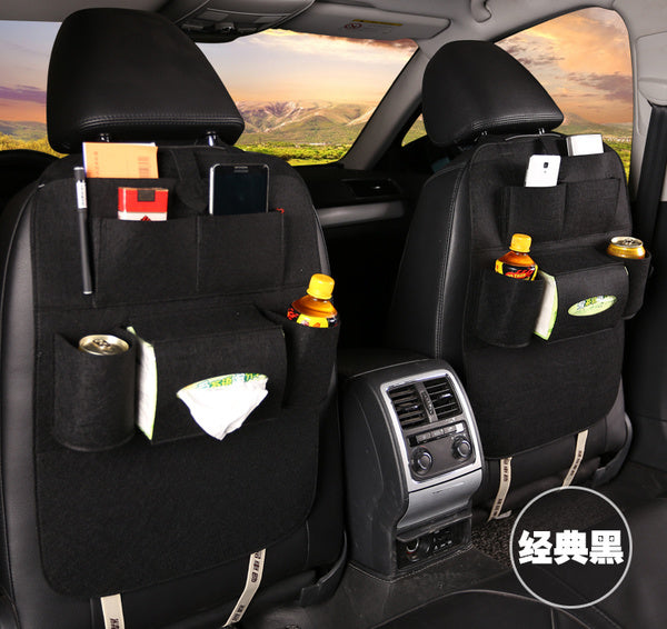 the back seats of a car with a variety of items in the back