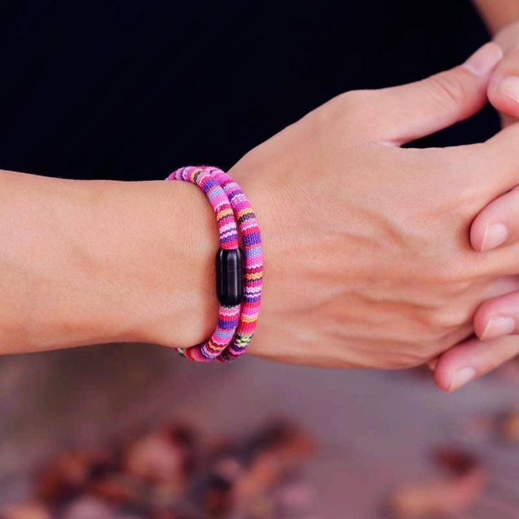 a person's hands with bracelets